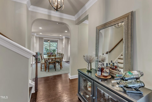 6509 Conaway Ct, Wake Forest, NC 27587 - entryway with arched walkways, crown molding, stairway, baseboards, and dark wood-style floors