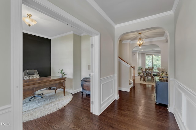 6509 Conaway Ct, Wake Forest, NC 27587 - office area with arched walkways, wood finished floors, crown molding, wainscoting, and a decorative wall