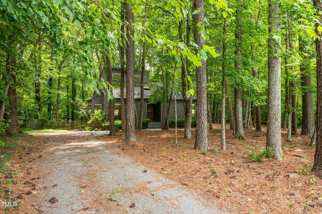 120 Polks Landing Rd, Chapel Hill, NC 27516 - view of property hidden behind natural elements with gravel driveway and a forest view