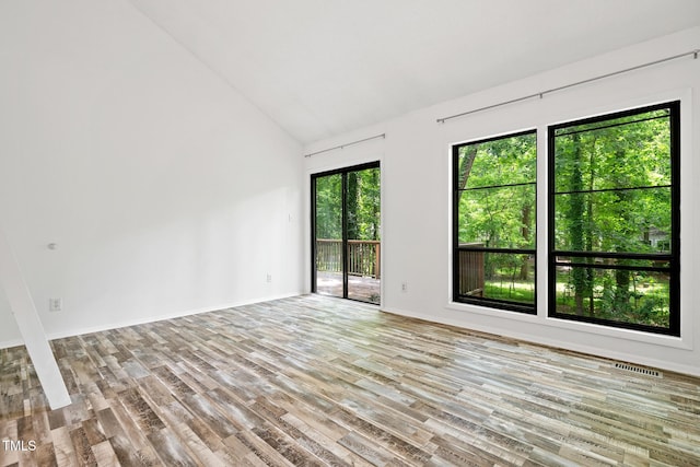 120 Polks Landing Rd, Chapel Hill, NC 27516 - unfurnished room featuring vaulted ceiling, wood finished floors, and baseboards