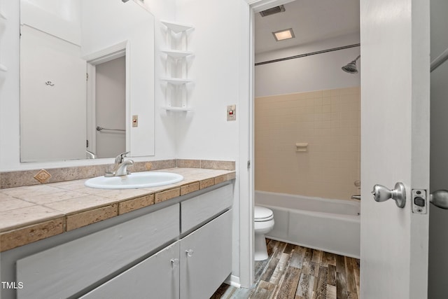 120 Polks Landing Rd, Chapel Hill, NC 27516 - bathroom with toilet, vanity, wood finished floors, and tub / shower combination