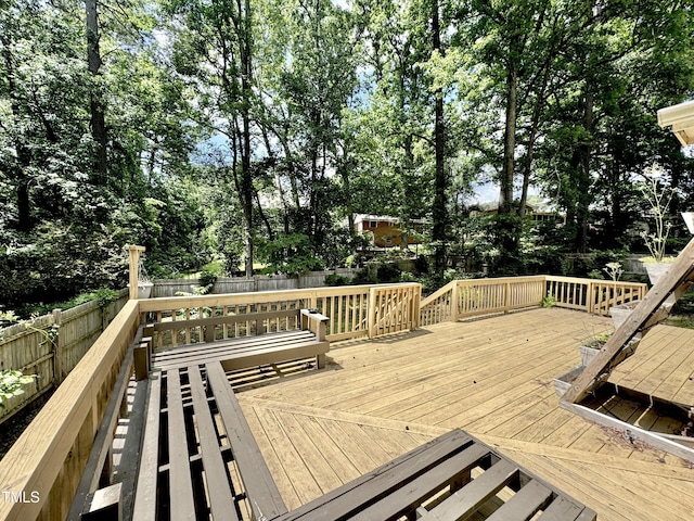 322 S Dixon Ave, Cary, NC 27511 - wooden deck with a fenced backyard and view of wooded area