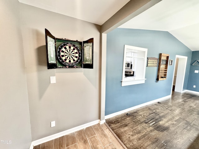322 S Dixon Ave, Cary, NC 27511 - hall featuring wood finished floors, vaulted ceiling, and baseboards