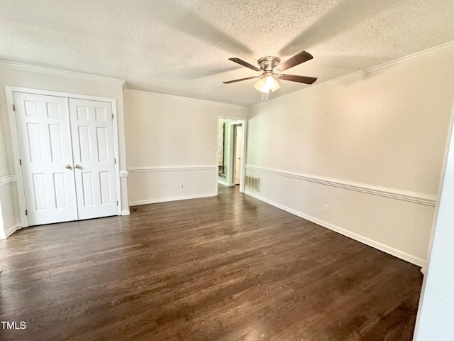 322 S Dixon Ave, Cary, NC 27511 - unfurnished bedroom with dark wood finished floors, a textured ceiling, ornamental molding, a closet, and baseboards