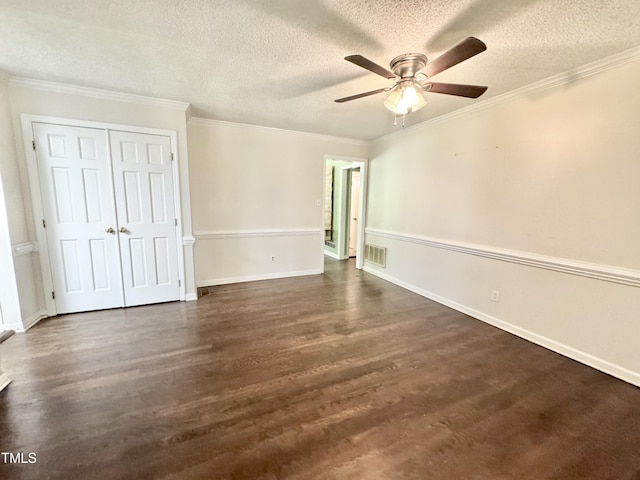 322 S Dixon Ave, Cary, NC 27511 - unfurnished bedroom featuring a textured ceiling, dark wood-style flooring, baseboards, a closet, and ornamental molding