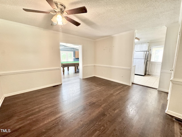 322 S Dixon Ave, Cary, NC 27511 - empty room featuring a textured ceiling, dark wood-style flooring, ornamental molding, a ceiling fan, and billiards table