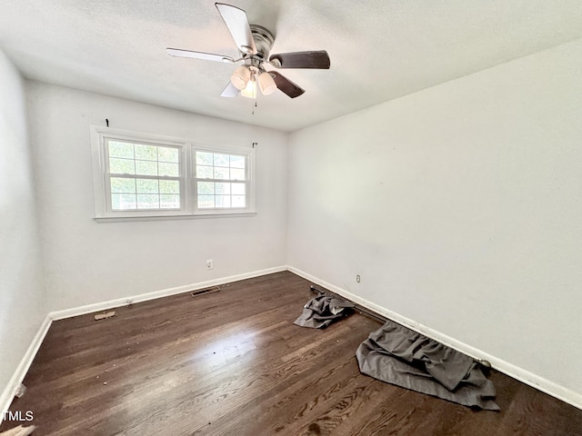 322 S Dixon Ave, Cary, NC 27511 - empty room with dark wood finished floors, baseboards, a ceiling fan, and a textured ceiling