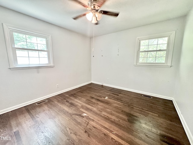 322 S Dixon Ave, Cary, NC 27511 - empty room featuring healthy amount of natural light, ceiling fan, dark wood-style flooring, and baseboards