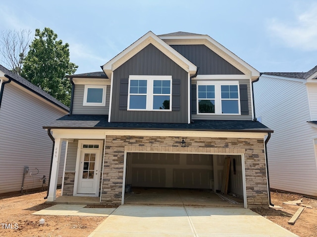 285 Gregory Village Dr, Lillington, NC 27546 - craftsman-style home featuring a garage, stone siding, and concrete driveway