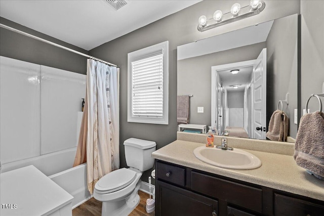 224 Swann Trl, Clayton, NC 27527 - full bath with vanity, toilet, shower / tub combo with curtain, and wood finished floors