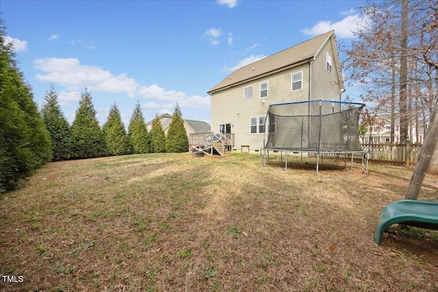 224 Swann Trl, Clayton, NC 27527 - back of property featuring a trampoline and a wooden deck