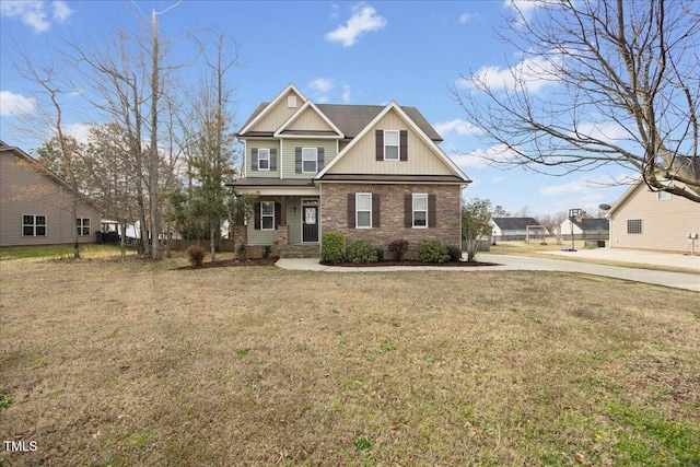 224 Swann Trl, Clayton, NC 27527 - craftsman house featuring a front lawn, board and batten siding, stone siding, and a porch