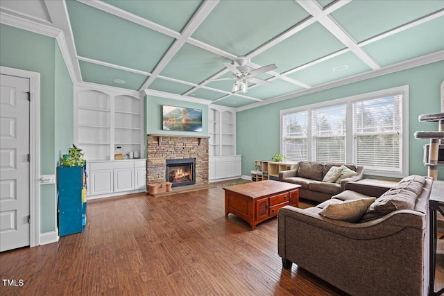 224 Swann Trl, Clayton, NC 27527 - living area featuring coffered ceiling, ceiling fan, wood finished floors, a fireplace, and built in shelves