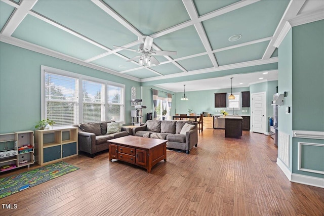 224 Swann Trl, Clayton, NC 27527 - living room with coffered ceiling, a ceiling fan, wood finished floors, recessed lighting, and crown molding