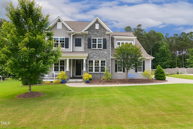 8909 Tara Hill Ln, Wake Forest, NC 27587 - craftsman-style home featuring stone siding, a porch, and roof with shingles