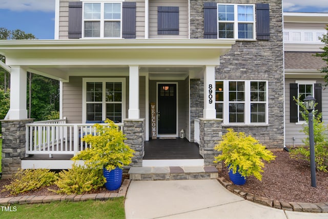 8909 Tara Hill Ln, Wake Forest, NC 27587 - entrance to property featuring stone siding and a porch