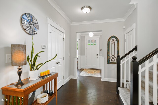 8909 Tara Hill Ln, Wake Forest, NC 27587 - foyer entrance featuring crown molding, dark wood-style floors, stairs, and baseboards