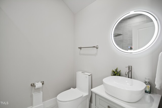 8909 Tara Hill Ln, Wake Forest, NC 27587 - bathroom featuring toilet, lofted ceiling, vanity, and baseboards