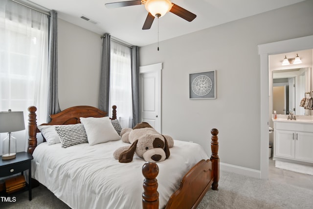 8909 Tara Hill Ln, Wake Forest, NC 27587 - bedroom with light colored carpet, a sink, baseboards, connected bathroom, and ceiling fan