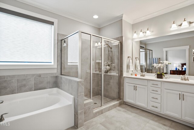 8909 Tara Hill Ln, Wake Forest, NC 27587 - full bathroom featuring a garden tub, double vanity, a stall shower, healthy amount of natural light, and crown molding