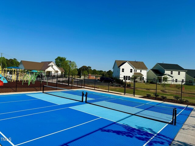 83 Ripple Way Unit 215, Clayton, NC 27520 - view of tennis court featuring community basketball court and a residential view