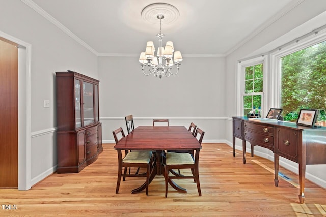 3806 Lochnora Pkwy, Durham, NC 27705 - dining area featuring a chandelier, light wood finished floors, ornamental molding, and baseboards