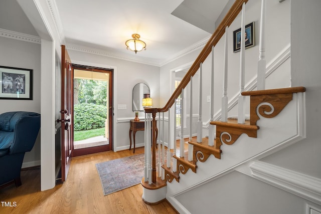 102 Pin Oak Ct, Elon, NC 27244 - entryway featuring stairs, wood finished floors, and ornamental molding