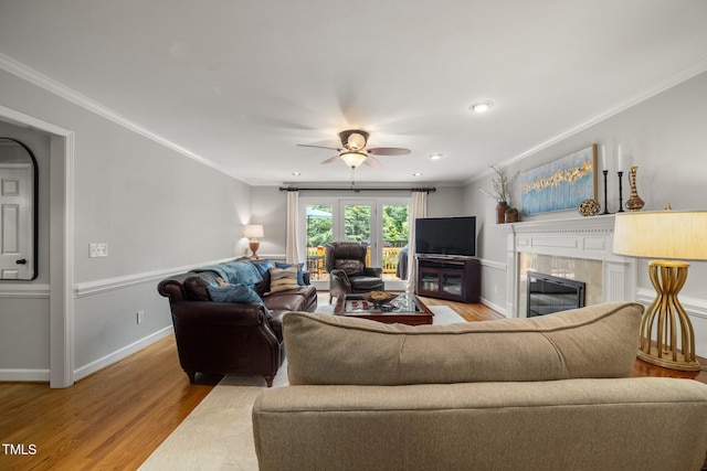 102 Pin Oak Ct, Elon, NC 27244 - living room featuring wood finished floors, ornamental molding, a ceiling fan, a premium fireplace, and baseboards