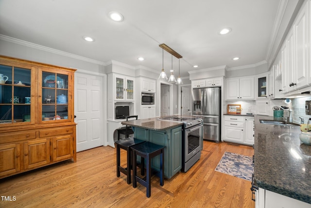 102 Pin Oak Ct, Elon, NC 27244 - kitchen with appliances with stainless steel finishes, a sink, white cabinets, recessed lighting, and crown molding
