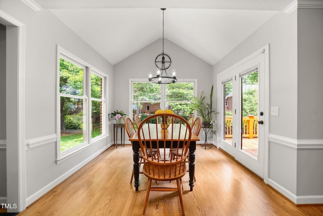 102 Pin Oak Ct, Elon, NC 27244 - dining area with a chandelier, light wood finished floors, vaulted ceiling, and plenty of natural light