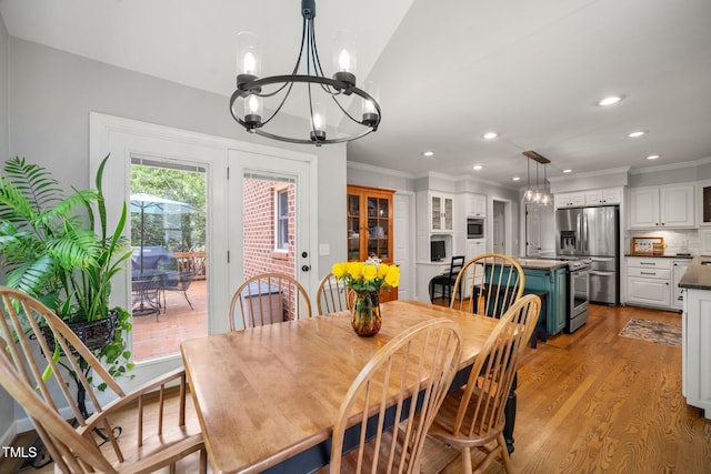 102 Pin Oak Ct, Elon, NC 27244 - dining space featuring a chandelier, crown molding, wood finished floors, and recessed lighting