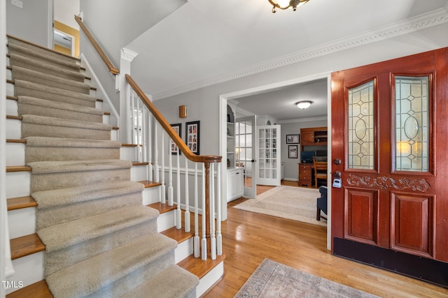 102 Pin Oak Ct, Elon, NC 27244 - entrance foyer featuring stairs, crown molding, light wood-style flooring, baseboards, and french doors