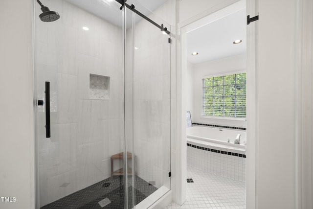 102 Pin Oak Ct, Elon, NC 27244 - full bathroom featuring a garden tub, a stall shower, and recessed lighting