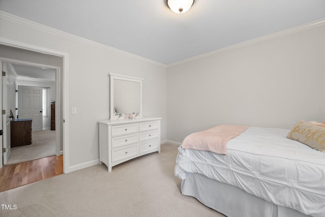 102 Pin Oak Ct, Elon, NC 27244 - bedroom with crown molding, baseboards, and light colored carpet