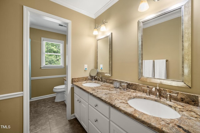 102 Pin Oak Ct, Elon, NC 27244 - full bathroom with double vanity, toilet, ornamental molding, tile patterned flooring, and baseboards