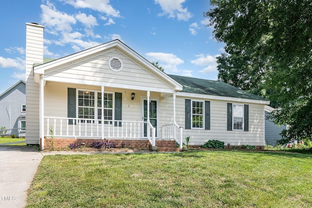 2108 Carthage Cir, Raleigh, NC 27604 - ranch-style house featuring covered porch, a chimney, and a front lawn
