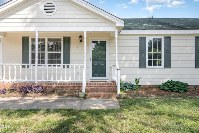 2108 Carthage Cir, Raleigh, NC 27604 - view of front of home featuring covered porch, a front lawn, and crawl space
