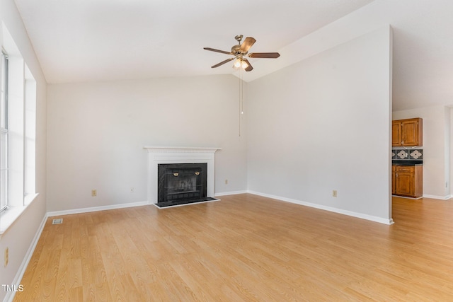 2108 Carthage Cir, Raleigh, NC 27604 - unfurnished living room featuring lofted ceiling, ceiling fan, a fireplace, light wood-style floors, and baseboards