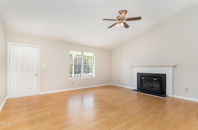 2108 Carthage Cir, Raleigh, NC 27604 - unfurnished living room featuring lofted ceiling, a ceiling fan, a fireplace with raised hearth, light wood finished floors, and baseboards