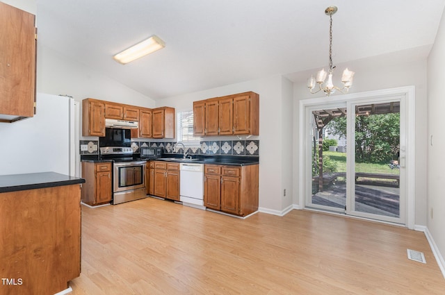 2108 Carthage Cir, Raleigh, NC 27604 - kitchen featuring white appliances, dark countertops, a chandelier, under cabinet range hood, and backsplash