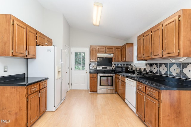 2108 Carthage Cir, Raleigh, NC 27604 - kitchen with white appliances, a sink, light wood-style flooring, vaulted ceiling, and under cabinet range hood