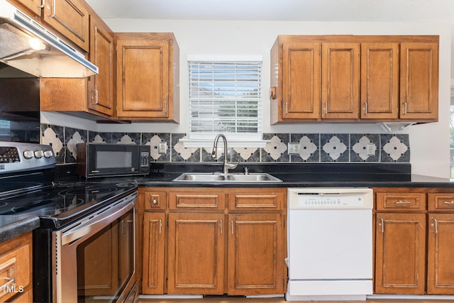 2108 Carthage Cir, Raleigh, NC 27604 - kitchen with white dishwasher, stainless steel electric range, under cabinet range hood, a sink, and black microwave