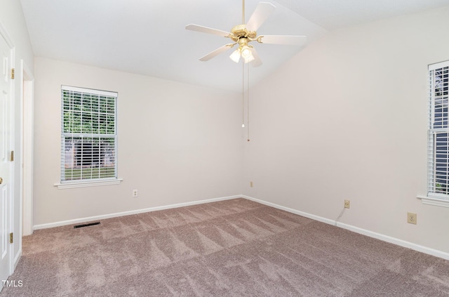 2108 Carthage Cir, Raleigh, NC 27604 - spare room featuring carpet flooring, vaulted ceiling, healthy amount of natural light, a ceiling fan, and baseboards