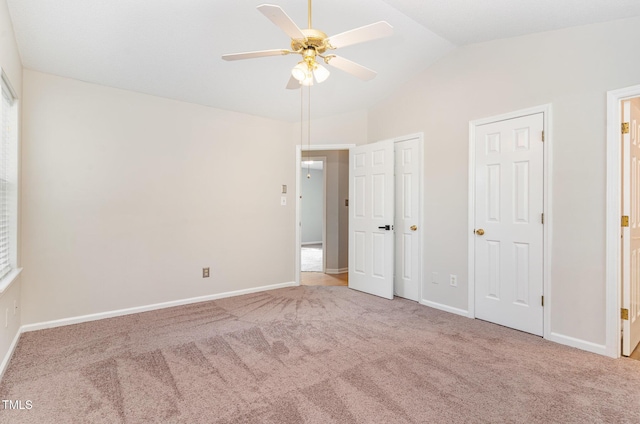 2108 Carthage Cir, Raleigh, NC 27604 - unfurnished bedroom with carpet flooring, vaulted ceiling, baseboards, multiple closets, and a ceiling fan
