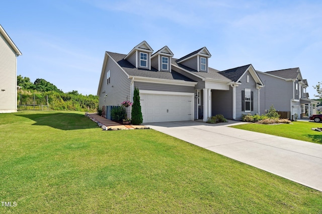 404 Porterfield Dr, Youngsville, NC 27596 - view of front of home with driveway, a front yard, an attached garage, and a shingled roof