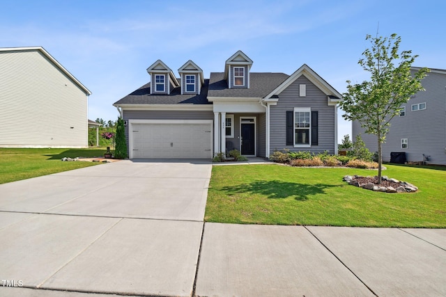 404 Porterfield Dr, Youngsville, NC 27596 - view of front of house featuring driveway, a front yard, a garage, and roof with shingles