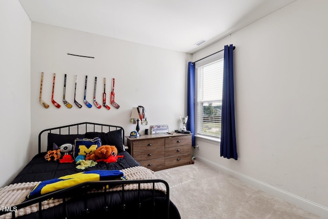 404 Porterfield Dr, Youngsville, NC 27596 - bedroom featuring carpet floors and multiple windows