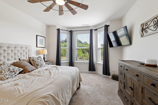 404 Porterfield Dr, Youngsville, NC 27596 - bedroom featuring light colored carpet and a ceiling fan