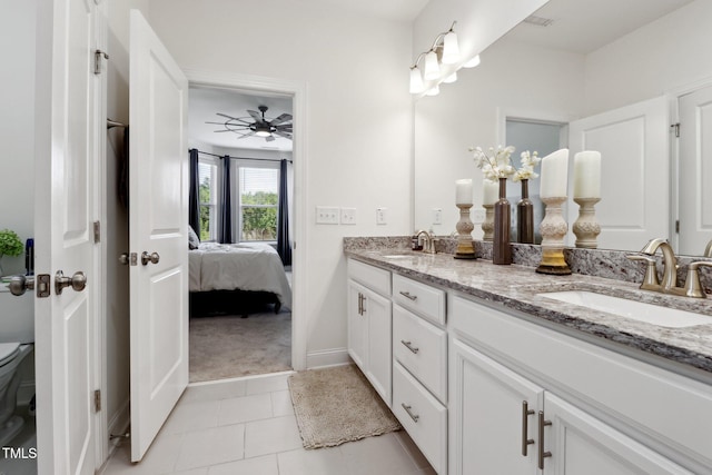 404 Porterfield Dr, Youngsville, NC 27596 - ensuite bathroom featuring double vanity, tile patterned floors, and ceiling fan