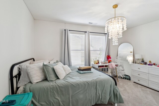 404 Porterfield Dr, Youngsville, NC 27596 - bedroom featuring a chandelier and light colored carpet